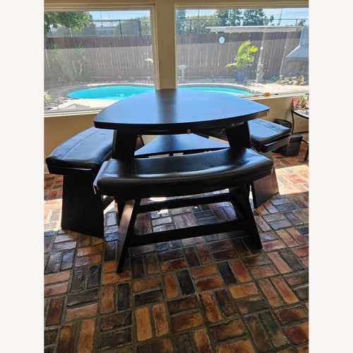 Used Rooms To Go Black Wood Dining Set for sale on AptDeco