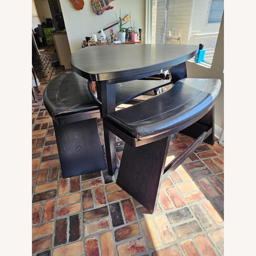 Used Rooms To Go Black Wood Dining Set for sale on AptDeco