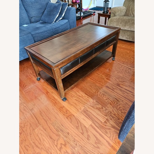 Used Rooms To Go Dark Brown Wood Coffee Table for sale on AptDeco