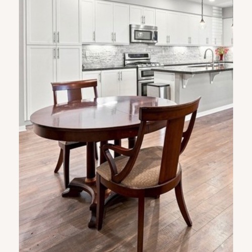 Used Ethan Allen Dark Brown Wood Dining Table for sale on AptDeco