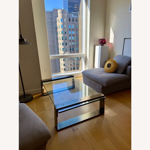 Used RH Glass & Stainless Steel Coffee Table for sale on AptDeco