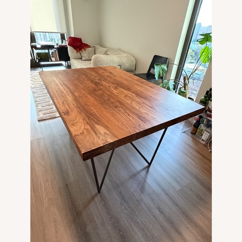 Used CB2 Dylan 36"x53" Medium Acacia Dining Table for sale on AptDeco
