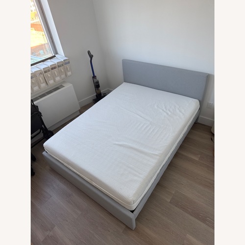 Used IKEA GLADSTAD Light Gray Wood Queen Bed for sale on AptDeco