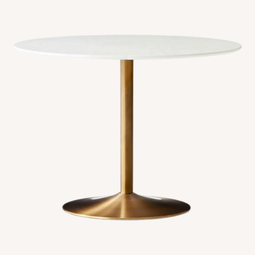 Used CB2 Odyssey Brass Dining Table for sale on AptDeco