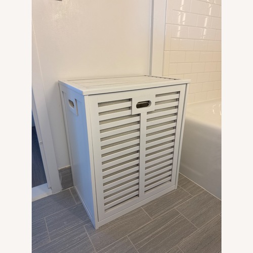 Used Tilt Out Laundry Hamper Cabinet for sale on AptDeco