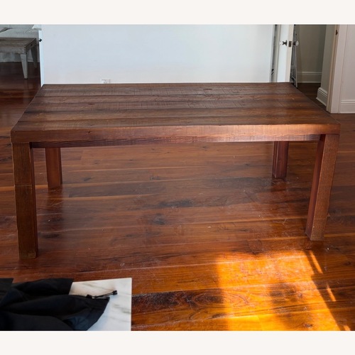 Used Dark Brown Wood Dining Table for sale on AptDeco