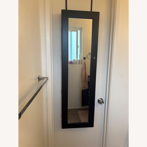 Used Black Wood Wall Mirror for sale on AptDeco