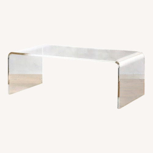 Used Clear Acrylic Waterfall Coffee Table for sale on AptDeco
