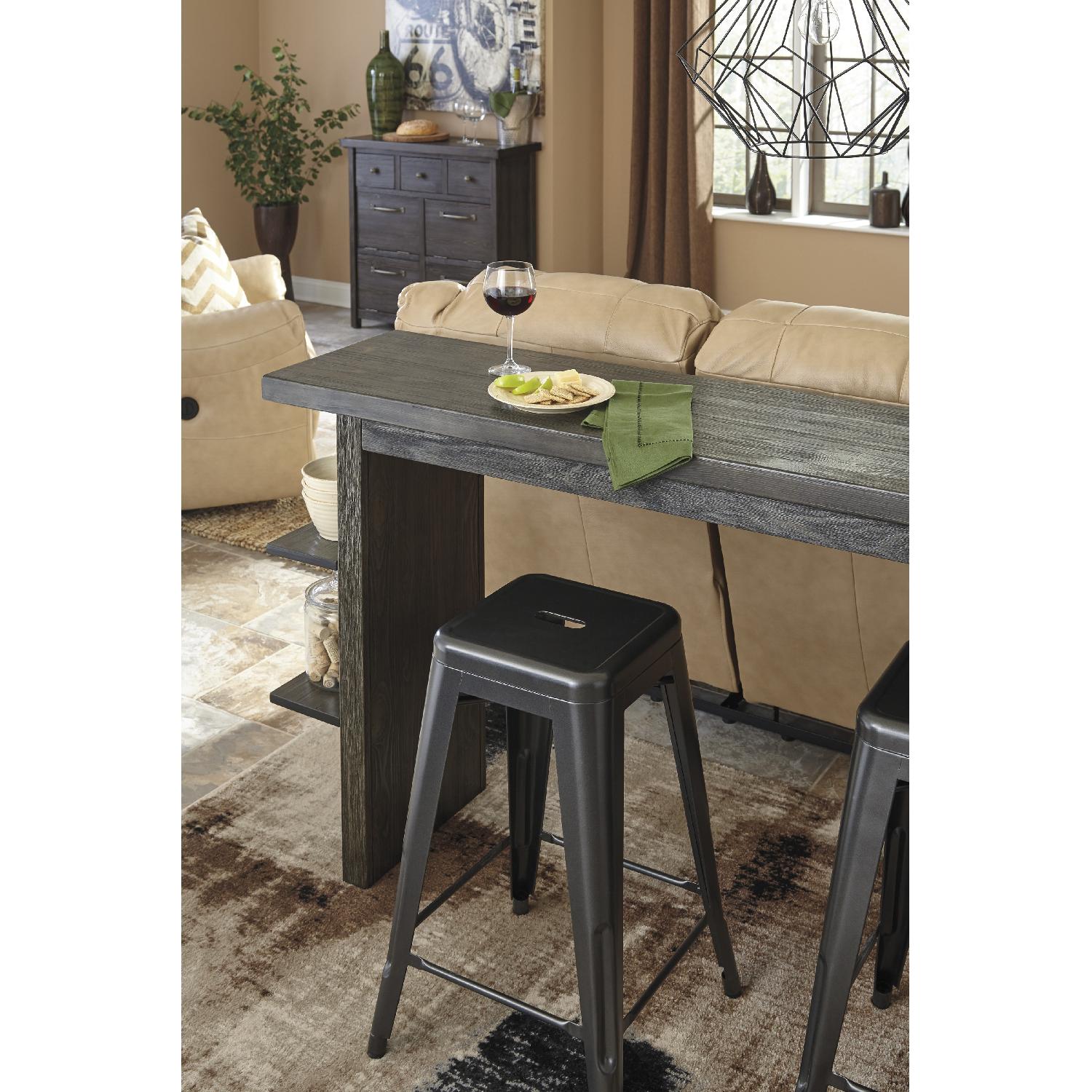 Ashley's Lamoille Long Counter Height Wooden Table w/ 4 Pinnadel Stools - image-3