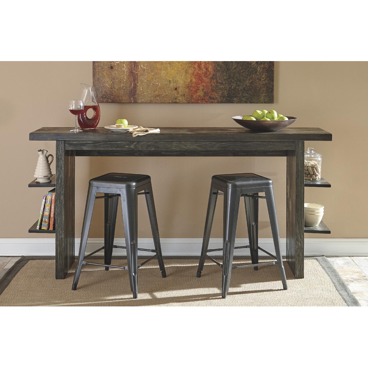Ashley's Lamoille Long Counter Height Wooden Table w/ 4 Pinnadel Stools - image-4