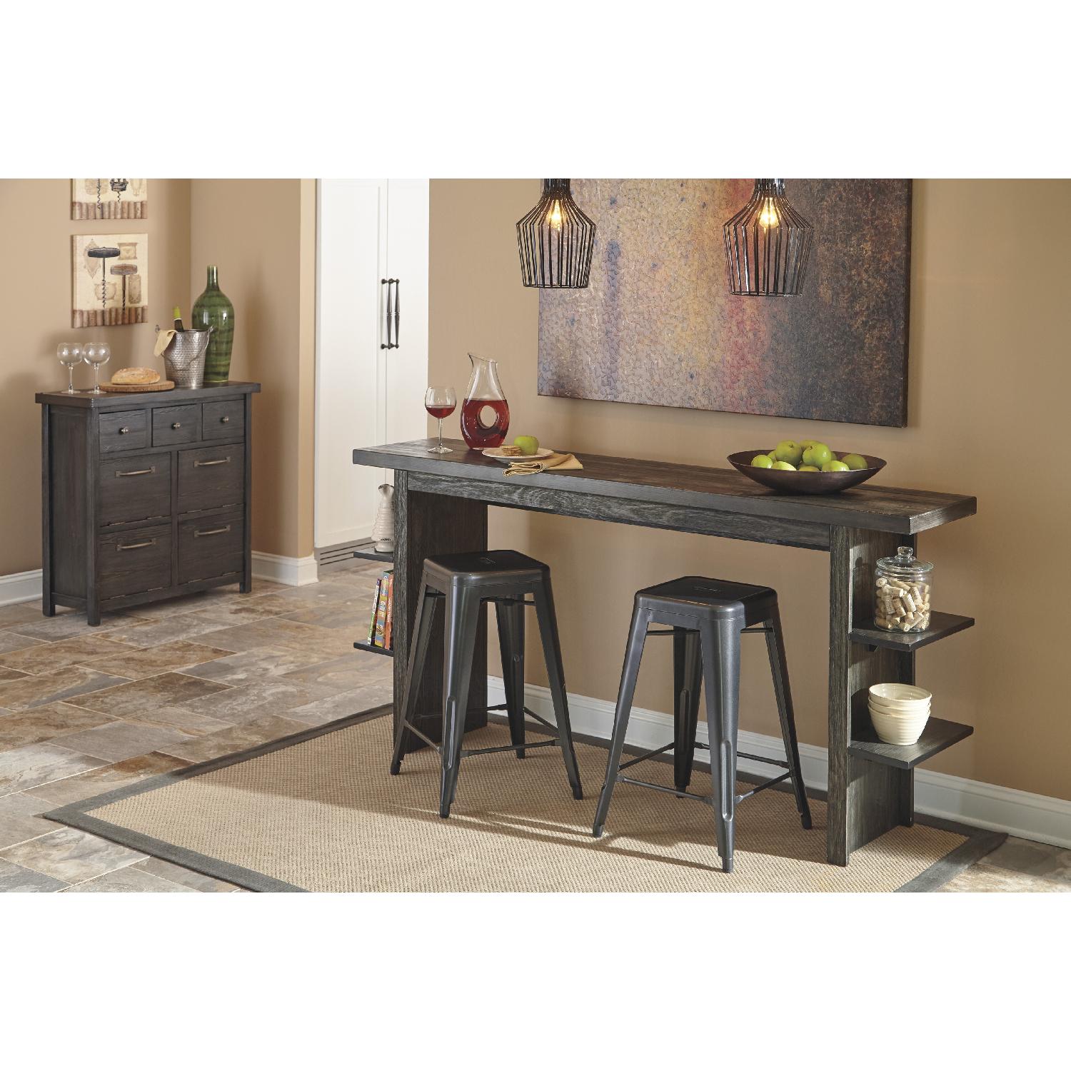 Ashley's Lamoille Long Counter Height Wooden Table w/ 4 Pinnadel Stools - image-5