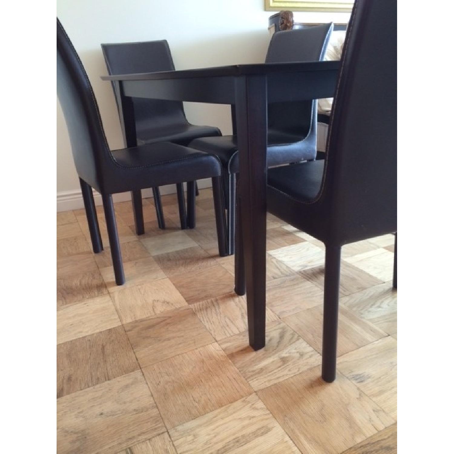 Dining Room Table w/ 4 Leather Chairs AptDeco