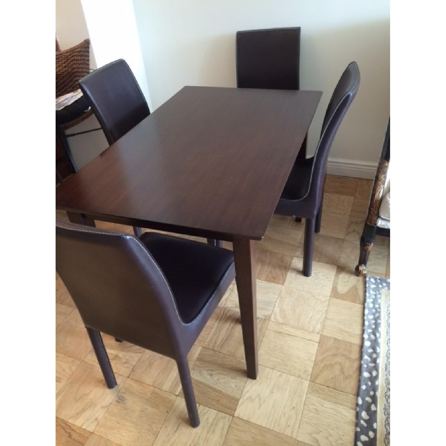 Dining Room Table w/ 4 Leather Chairs AptDeco
