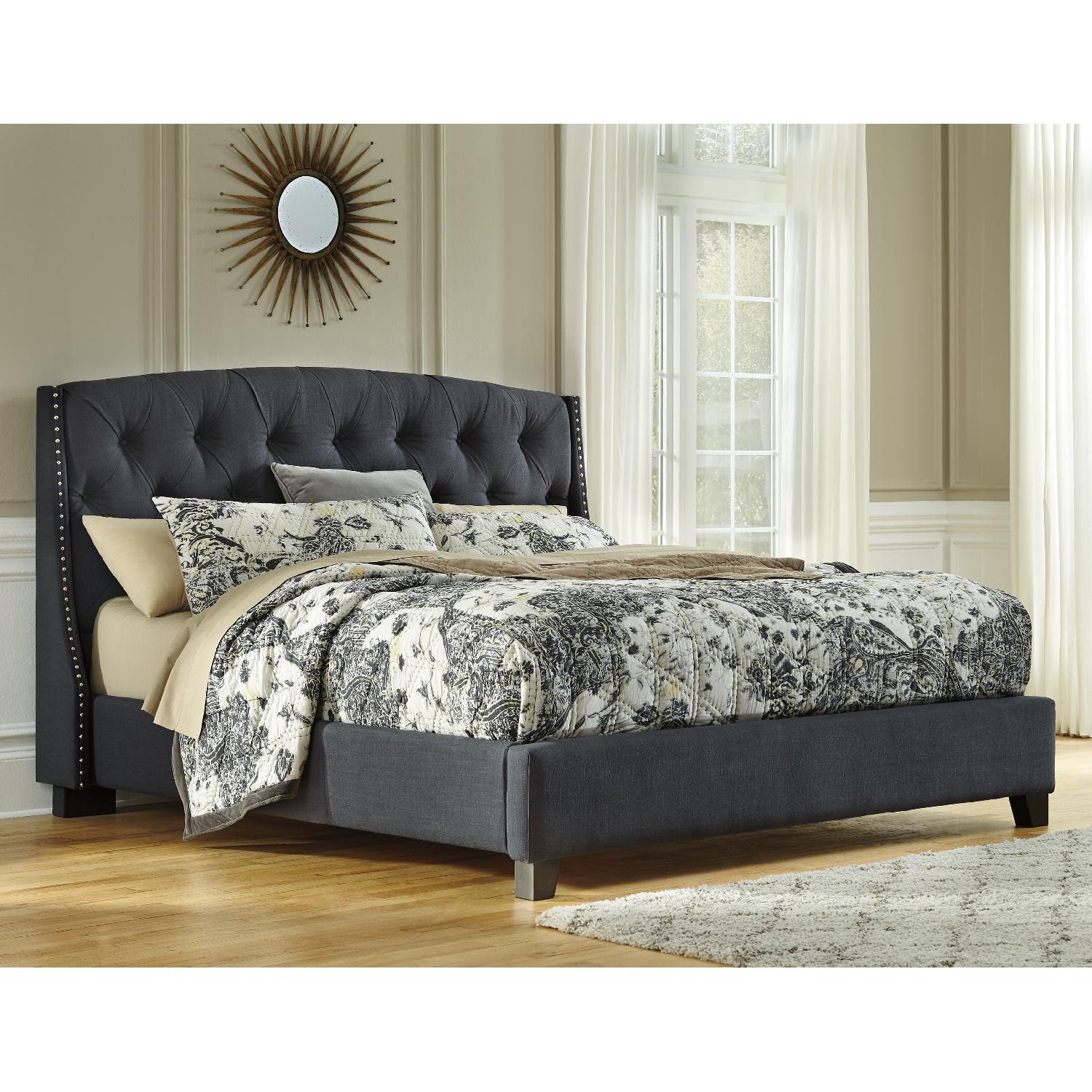 Ashley's Kasidon Contemporary Queen Upholstered Platform Bed in Dark Gray - image-1