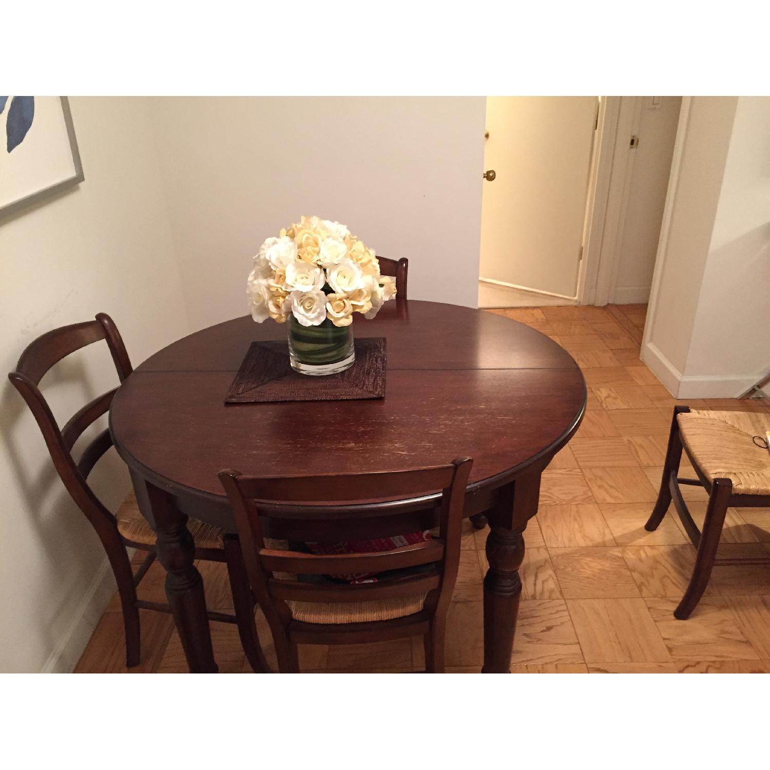 Pottery Barn Round Extending Dining Room Table w/ 4 Chairs - image-1