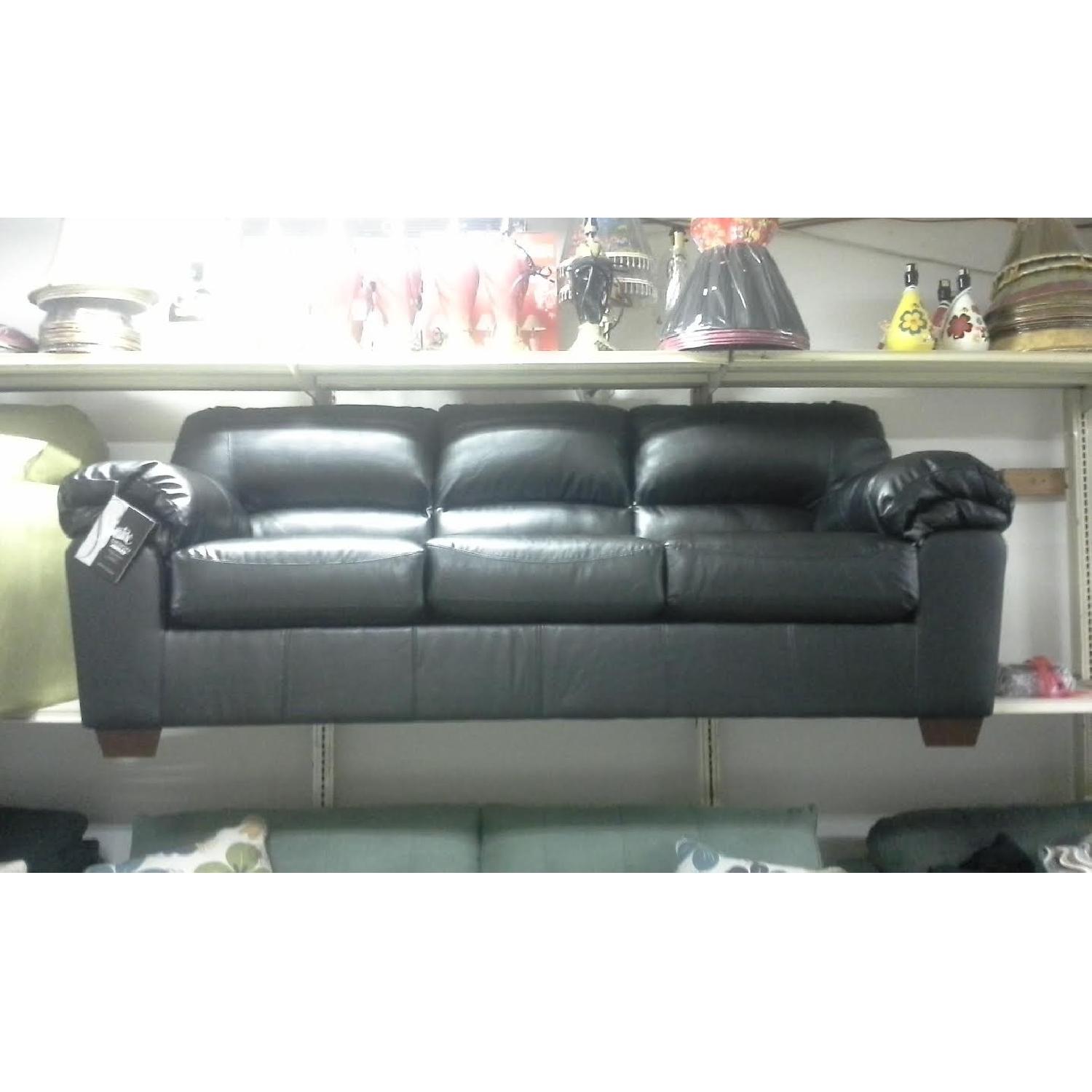 Ashley's Faux Leather Sofa - image-1