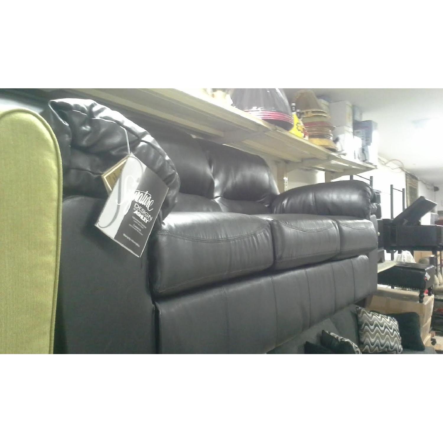 Ashley's Faux Leather Sofa - image-3