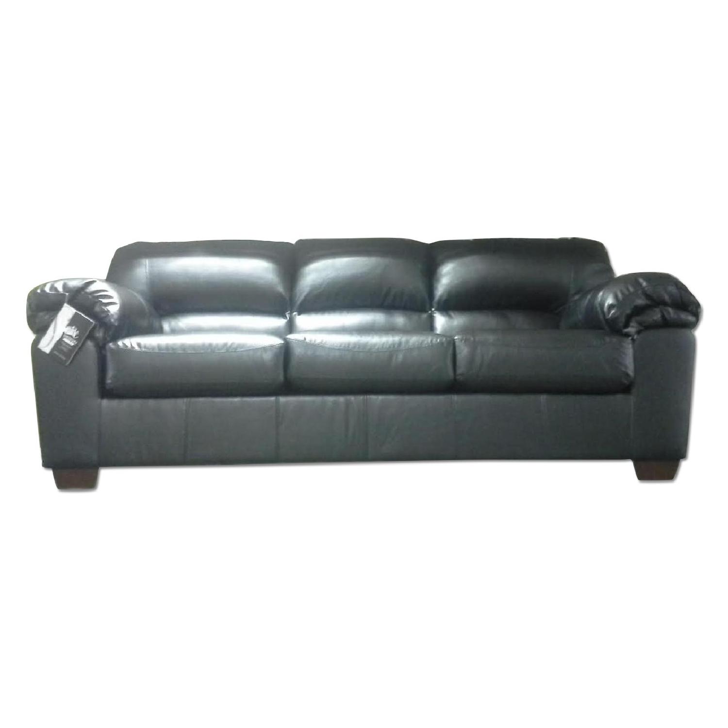 Ashley's Faux Leather Sofa - image-0