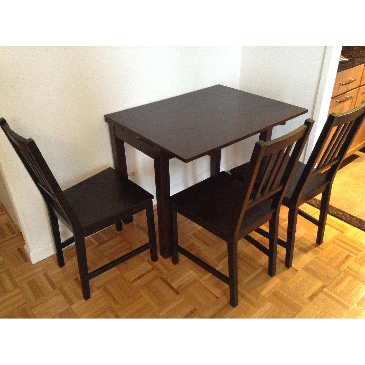 Ikea Dark Brown Bjursta Dining Table w/ 3 Chairs AptDeco