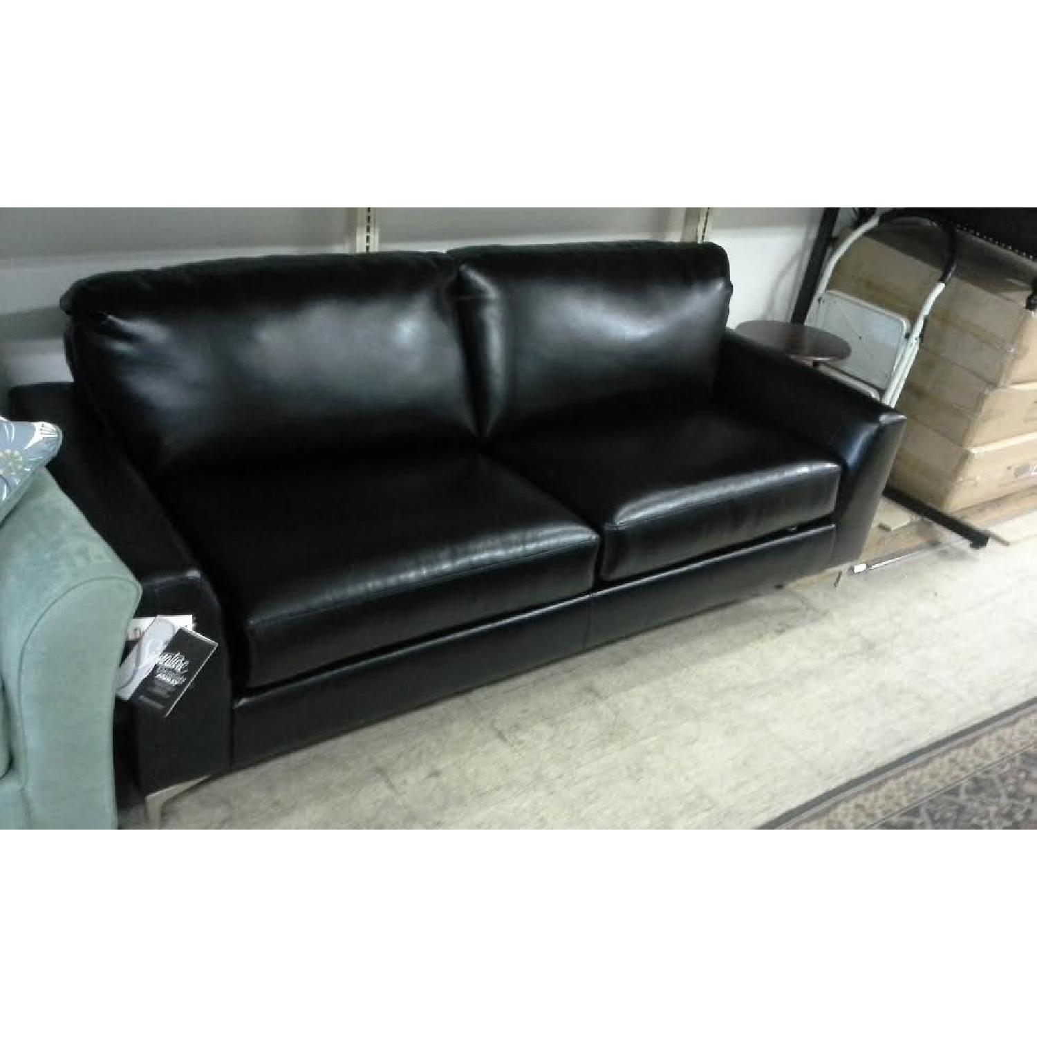 Ashley's Black Faux Leather Sofa - image-2