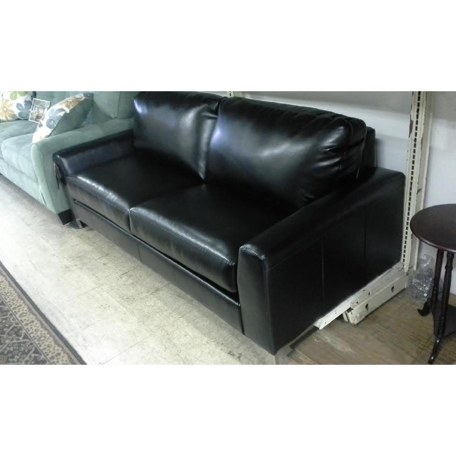 Ashley's Black Faux Leather Sofa - image-3