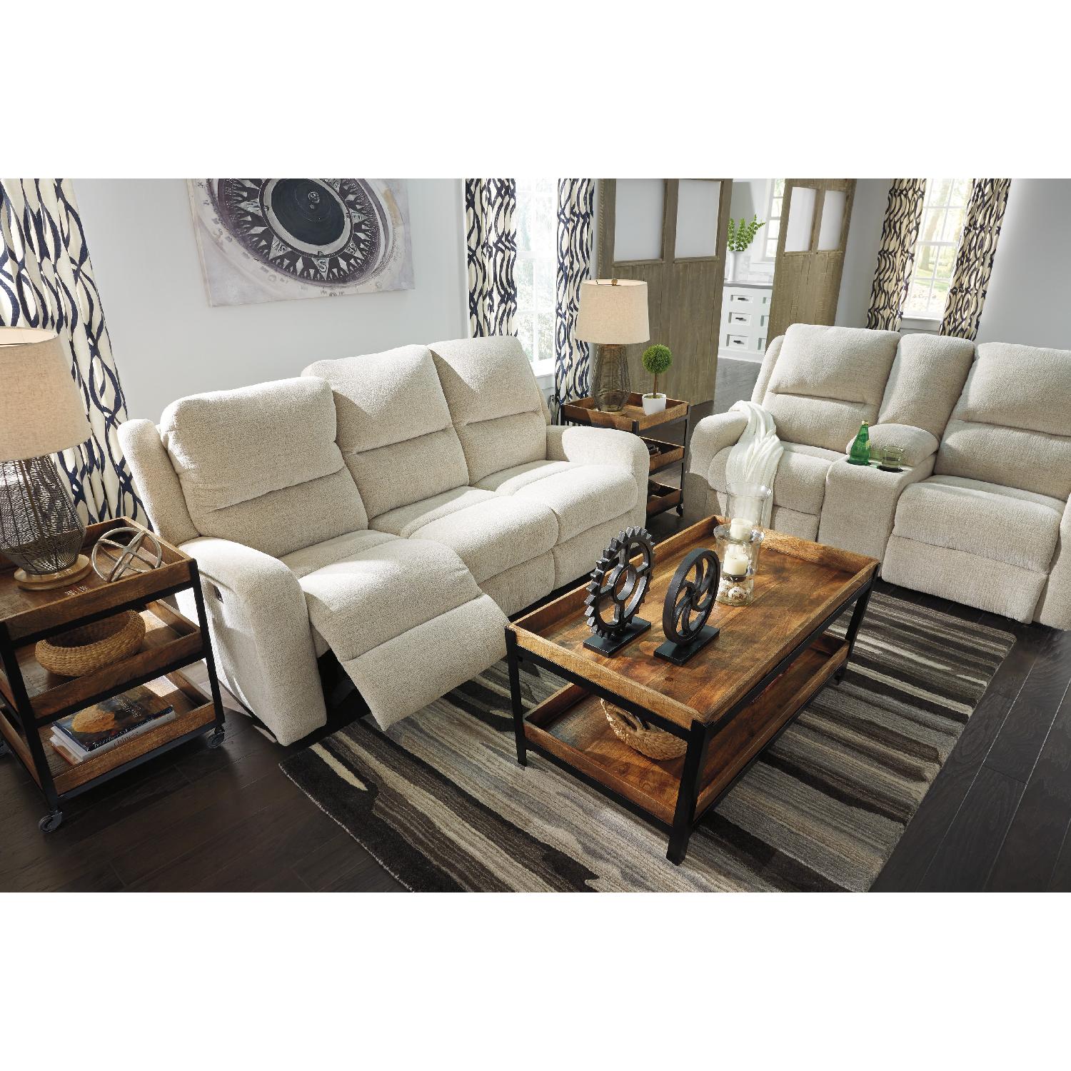 Ashley's Krismen Contemporary Power Reclining Sofa w/ Adjustable Headrest in Ivory Fabric - image-6