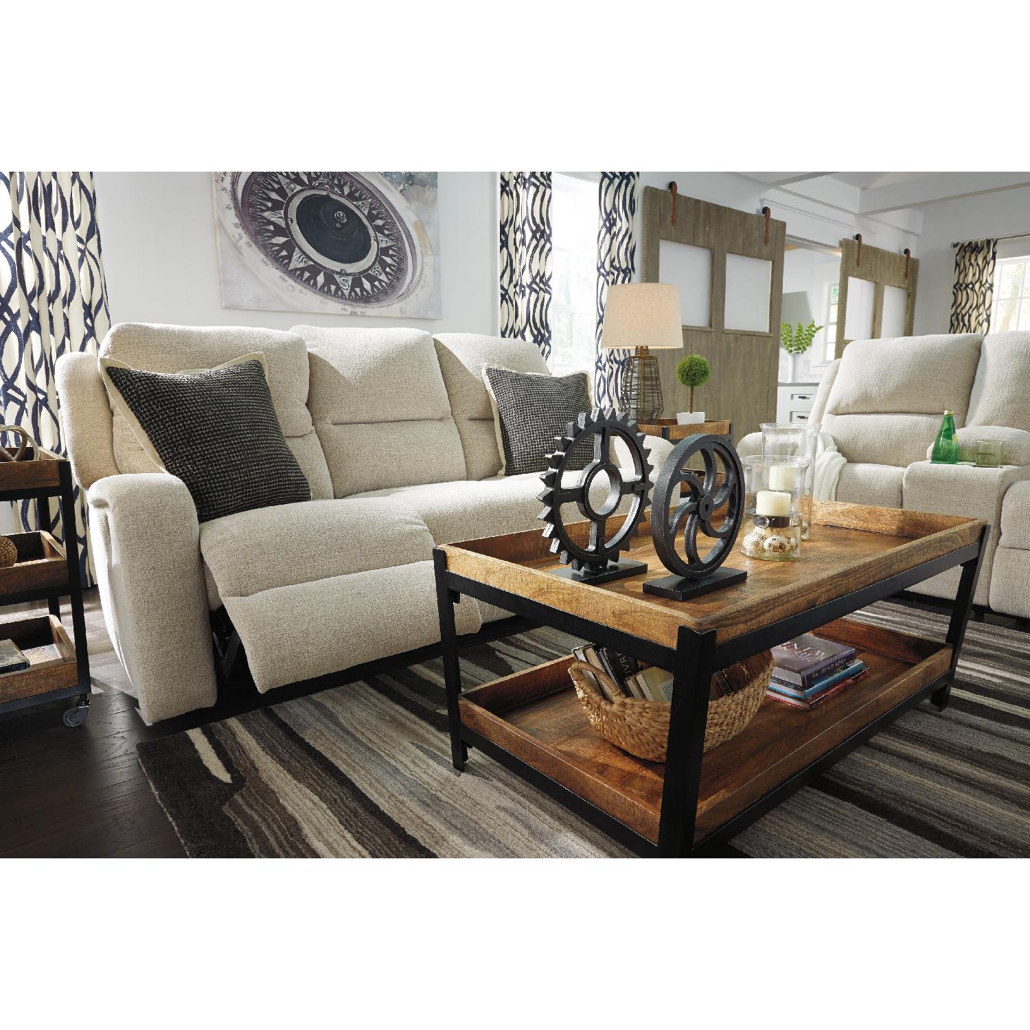 Ashley's Krismen Contemporary Power Reclining Sofa w/ Adjustable Headrest in Ivory Fabric - image-8