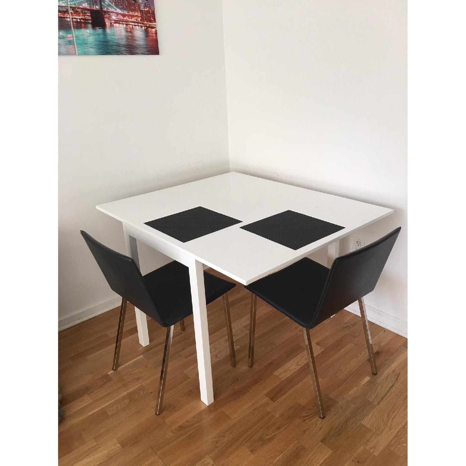 CB2 Extendable White Dining Table - image-4