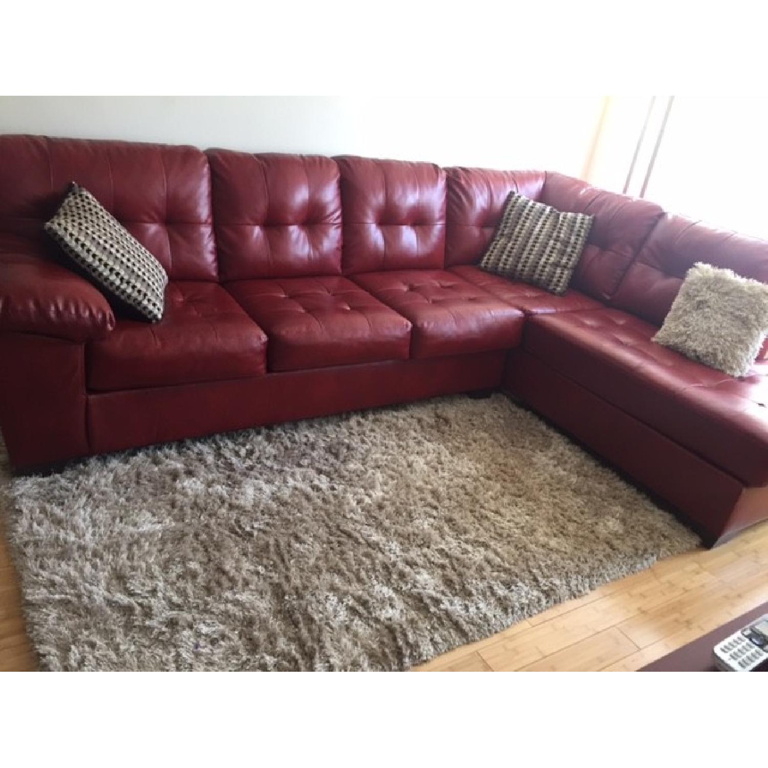 Ashley's Alliston Tufted Durablend Sectional in Red Salsa - image-1
