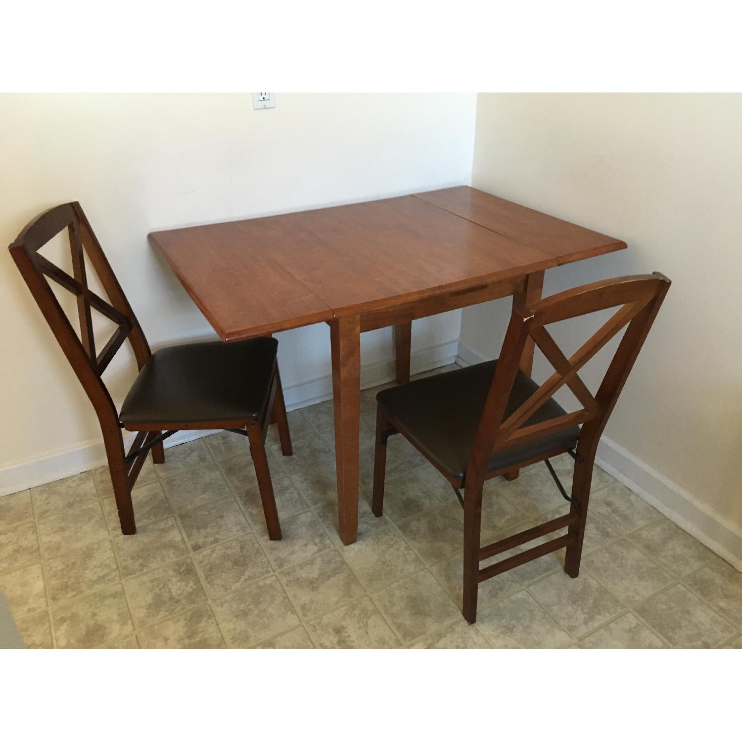 Solid Wood Extendable Dining Table w/ 4 Folding Dining Chairs - AptDeco