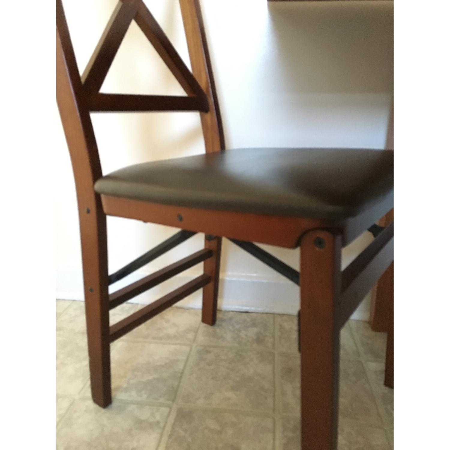 Solid Wood Extendable Dining Table w/ 4 Folding Dining Chairs - AptDeco