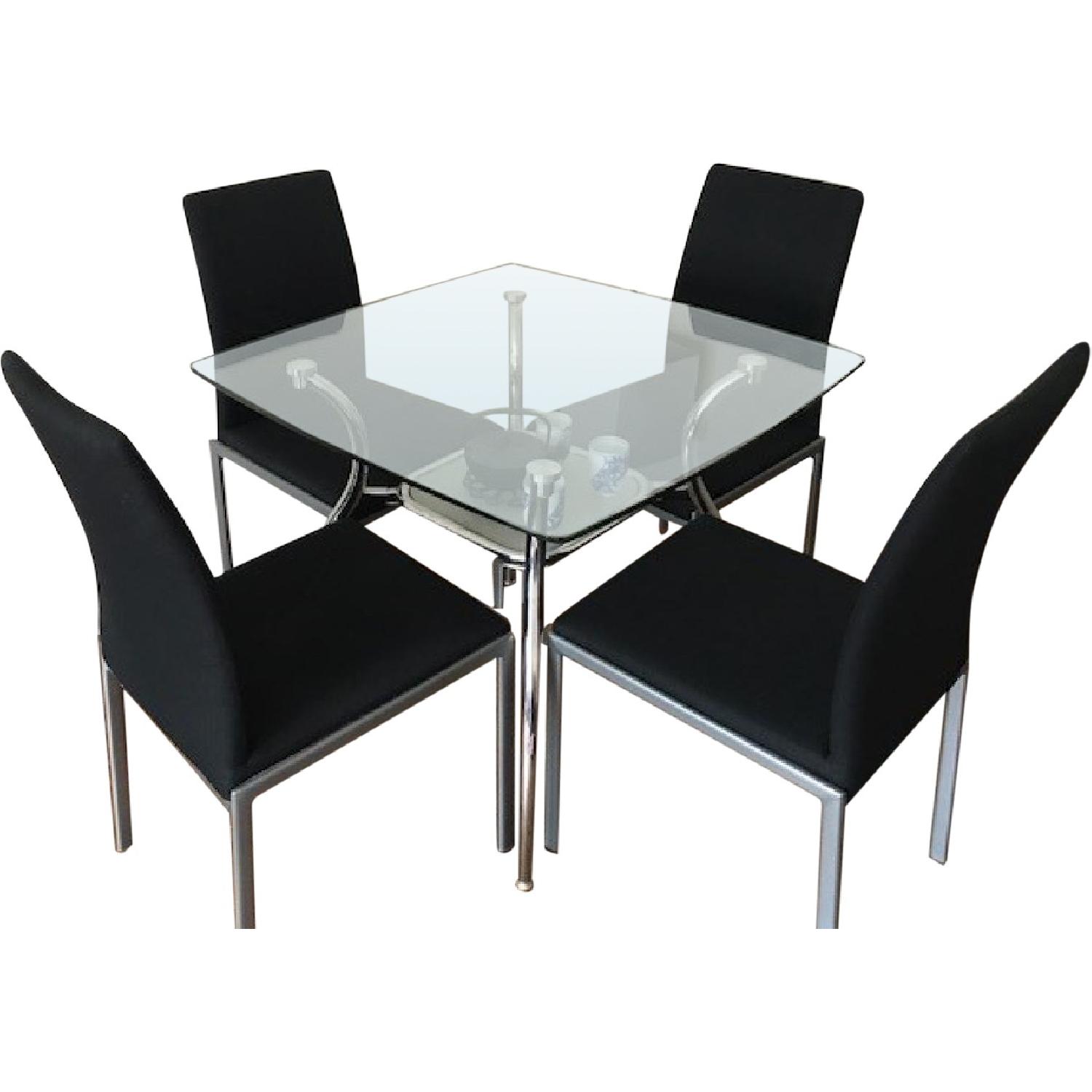 Glass Top/Metal Base Dining Table w/ 4 Black Fabric Chairs AptDeco