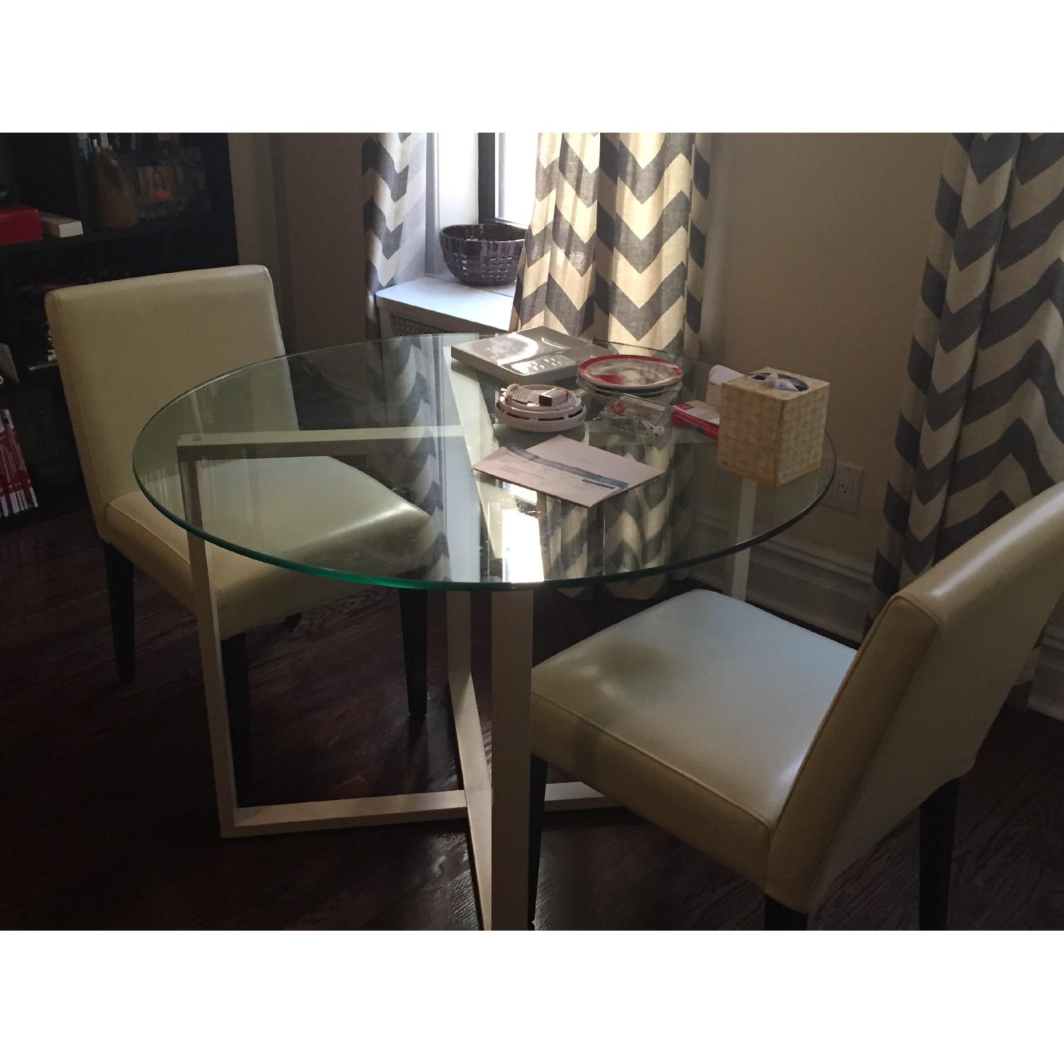 West Elm COllection Glass Dining Table with 2 Ivory Leather Chairs - image-1
