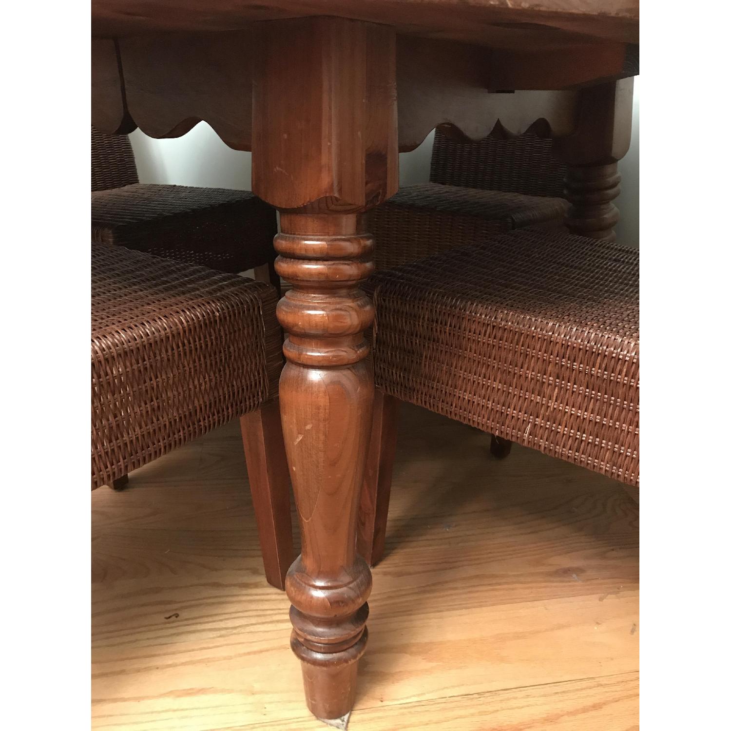 Antique Dining Room Table w/ 4 Wicker Chairs - AptDeco