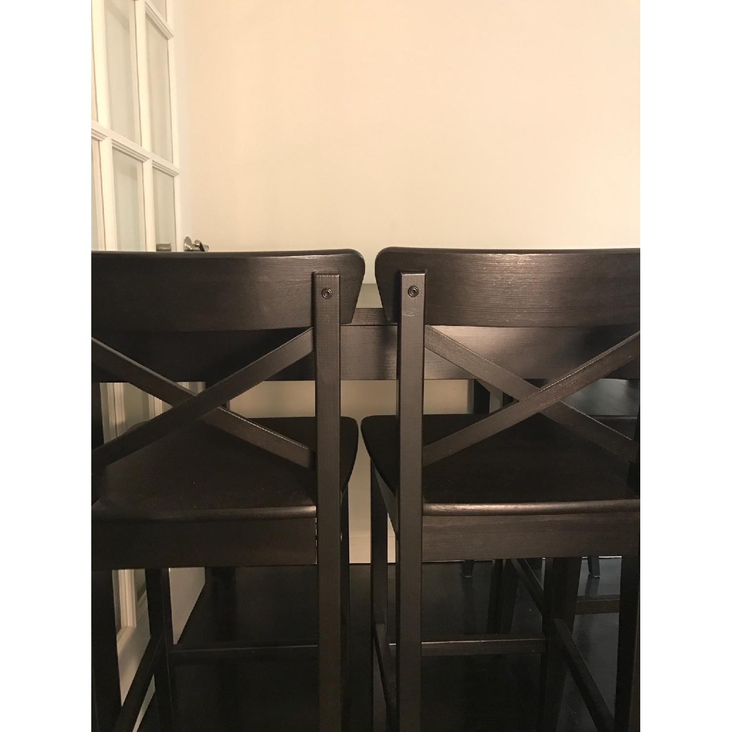 Ikea Bjursta Bar Table w/ 4 Ikea Ingolf Bar Stools AptDeco