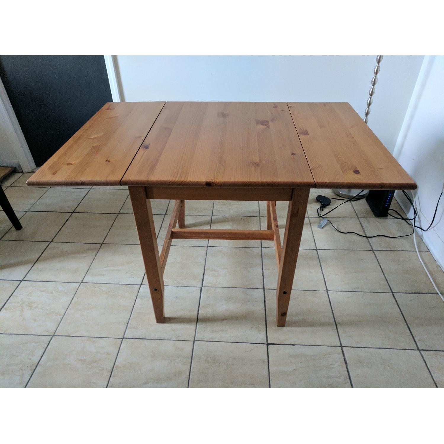 Wooden Dining Table w/ Adjustable Leaf - AptDeco