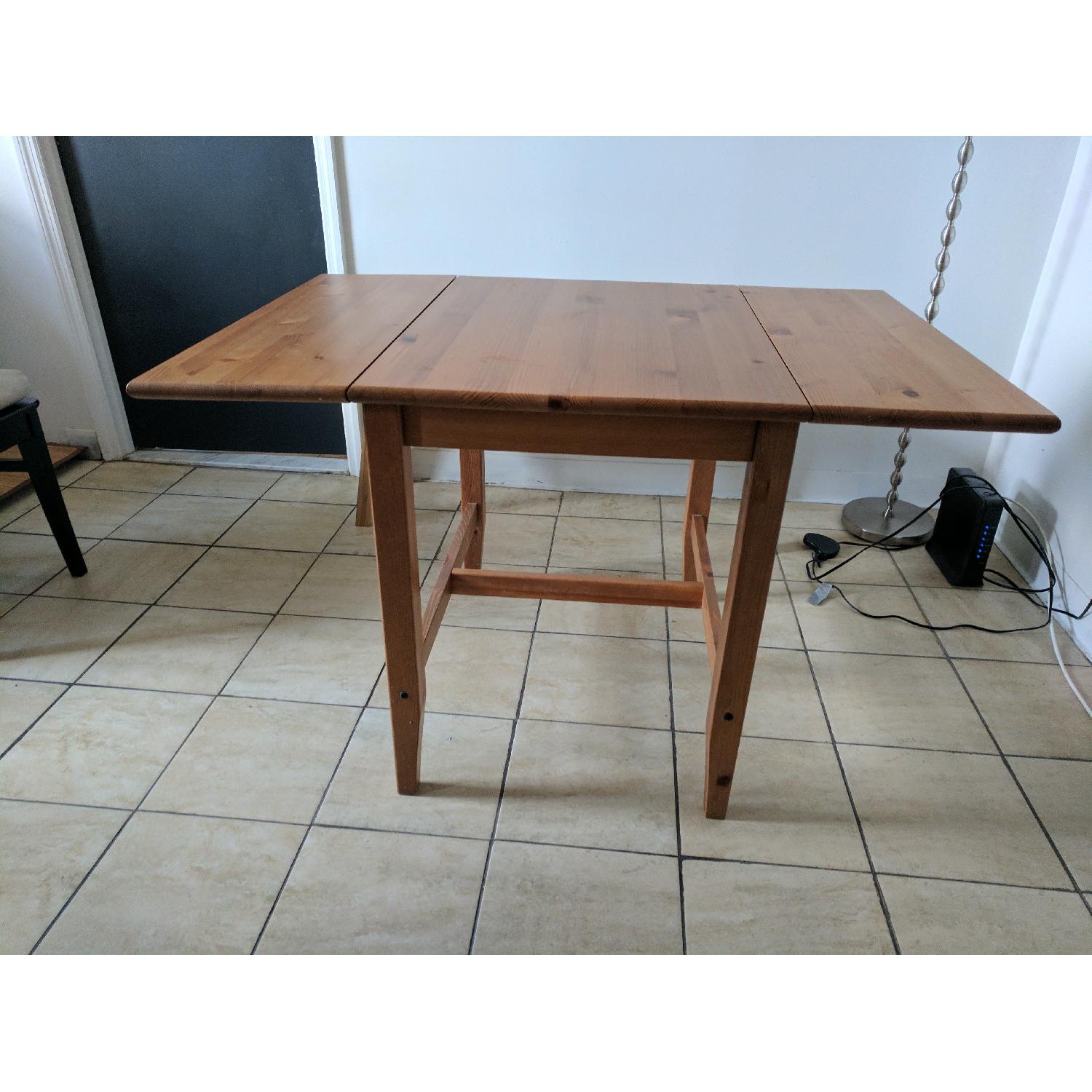 Wooden Dining Table w/ Adjustable Leaf - AptDeco